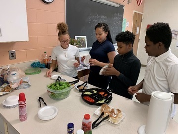 EIGHTH GRADERS PREPARE HEALTHY FOODS FROM USING HYDROPONICS TABLE