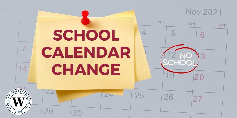 Nov. 2021 calendar with "No School" written on Nov. 12 and circled in red ink. Yellow post-it notes on calendar with red thumbtack. Post-it notes say "School Calendar Change." Warren County Schools, NC logo in a circle with a "W" in the center and  1885 at the bottom.