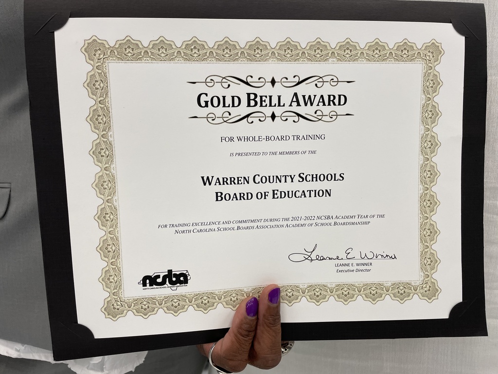Gold Bell Award for whole-board training is presented to the members of the Warren County Board of Education for training excellence and commitment during the 2021-2022 NCSBA Academy Year of the NC School Boards Association Academy  of School Boardsmanship