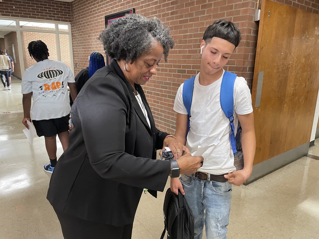 Principal Hanzer helps a student with his schedule